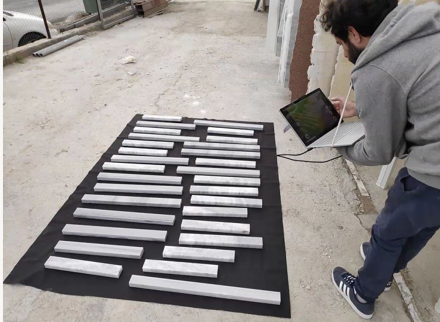Discarded marble blocks laid out for 3D scanning